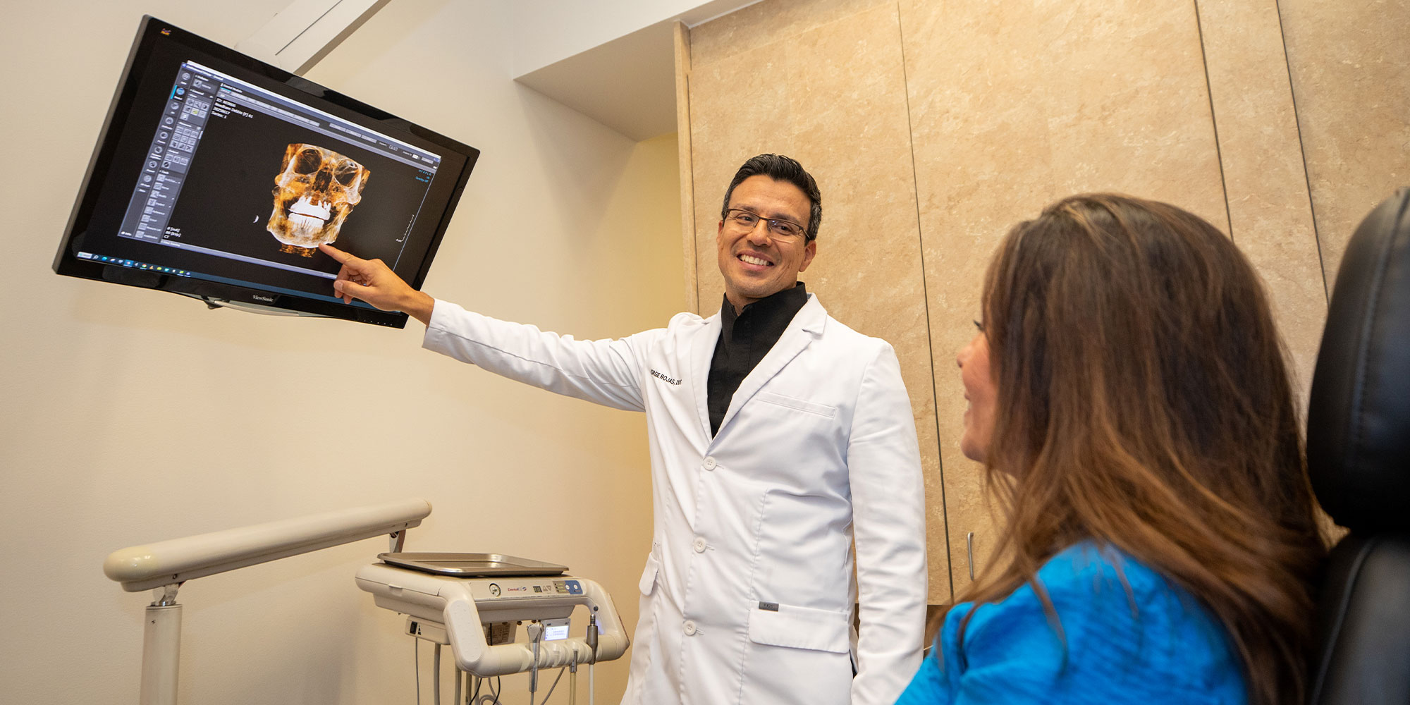 doctor going over dental procedure information