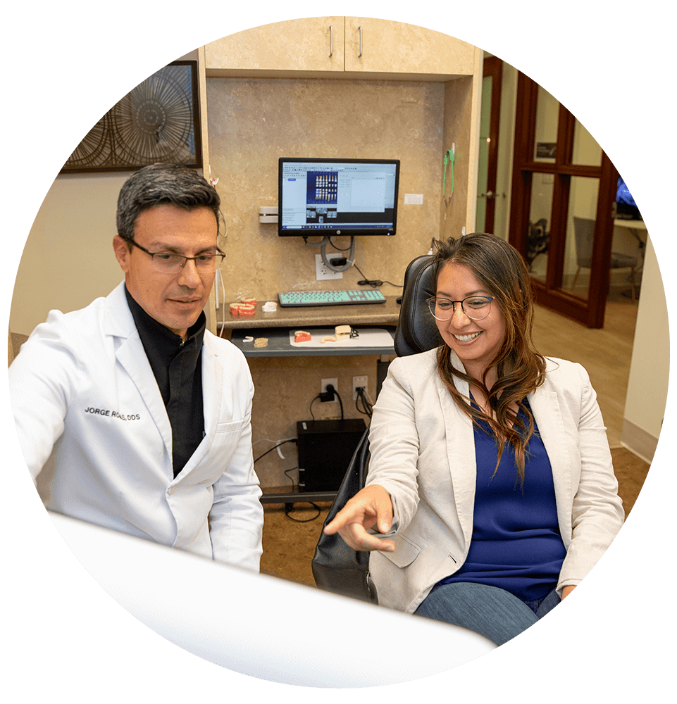 patient and doctor going over some dental procedure information
