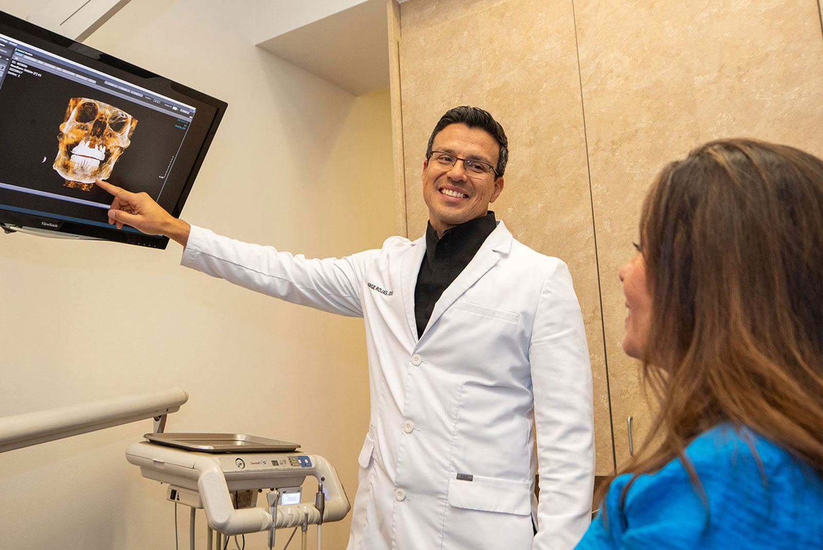 doctor going over dental procedure information with patient
