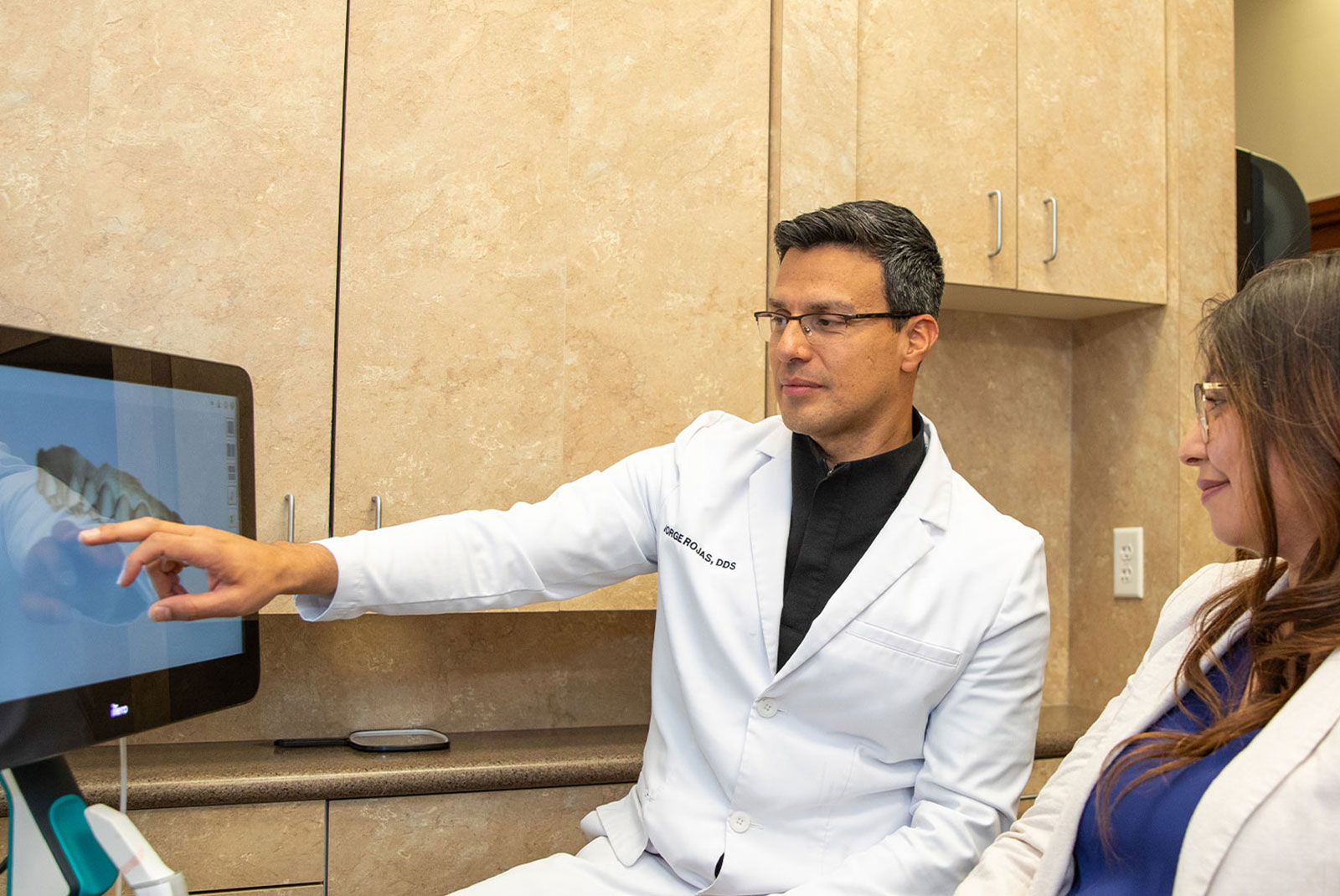 patient and doctor going over dental procedure information