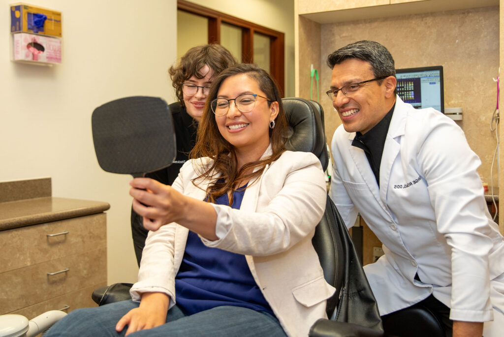 patient smiling brightly after their dental treatment