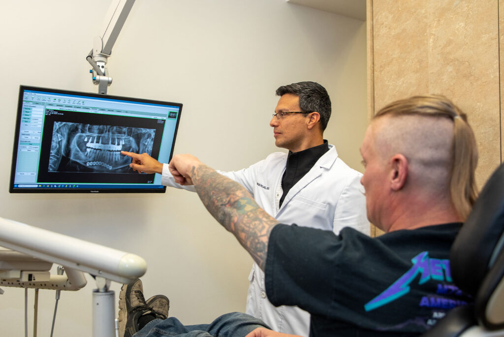 doctor and dental patient going over dental procedure