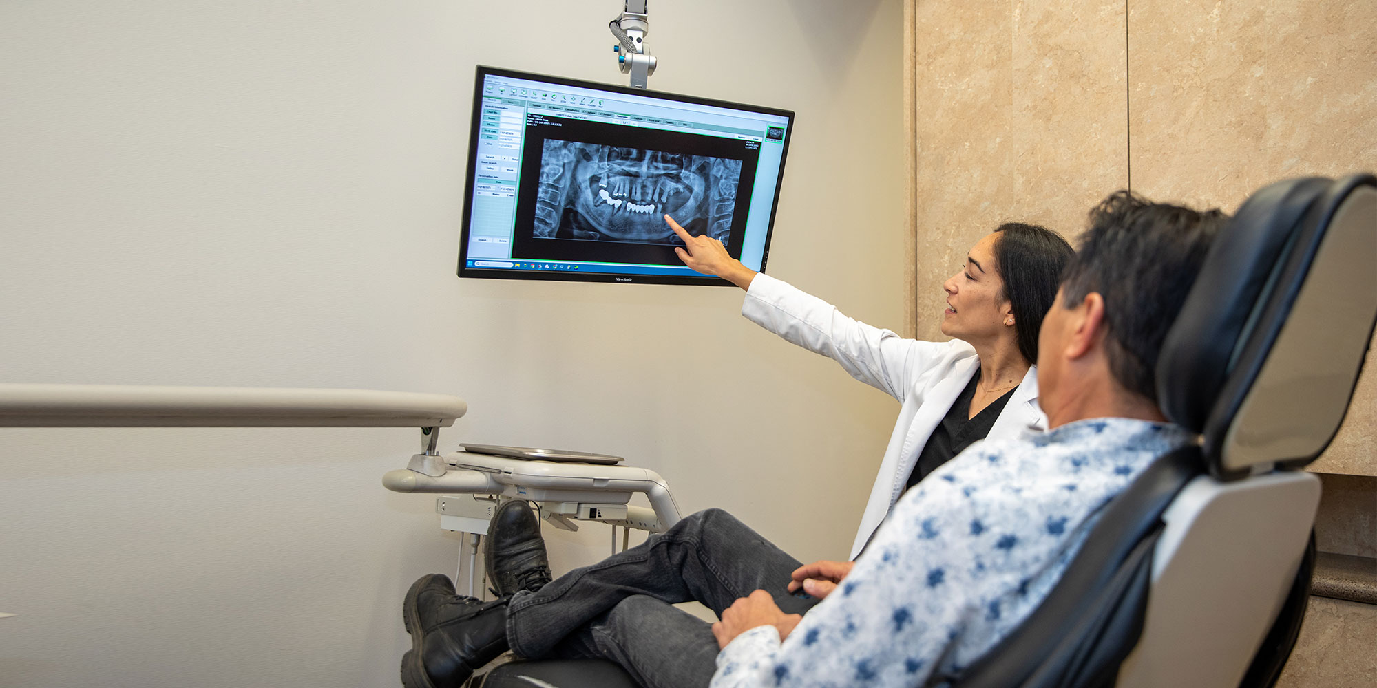 doctor going over dental procedure information